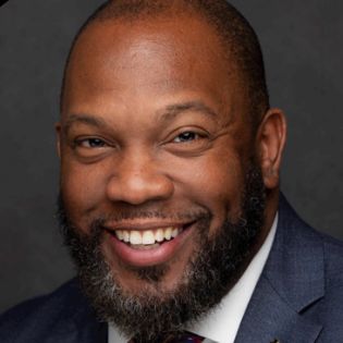  headshot of brent mitchell smiling